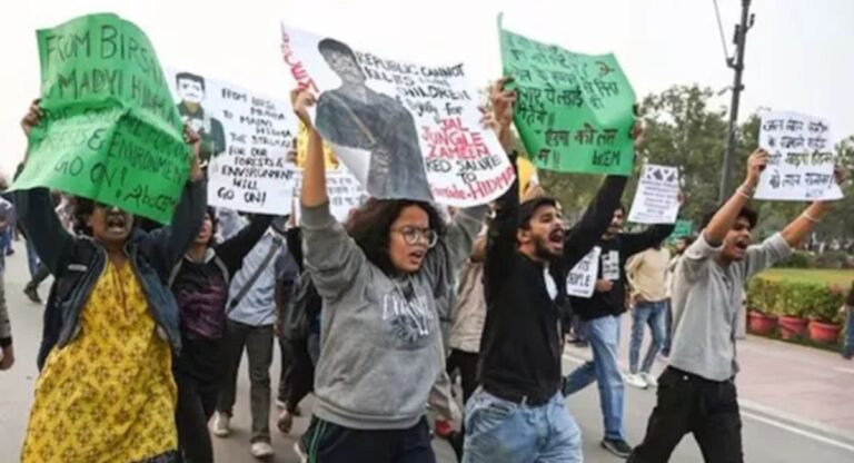 Protesters rallying in Delhi against environmental issues.