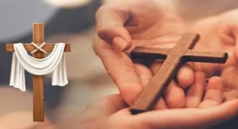 Cross symbolizing Christianity held in hands