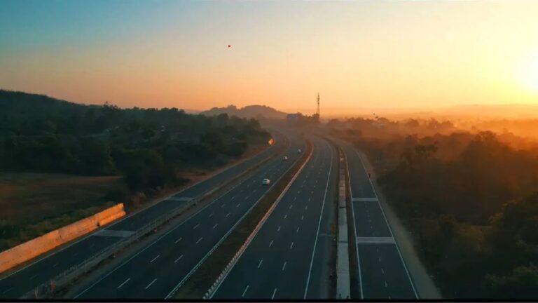 Sunset view of a national highway with vehicles