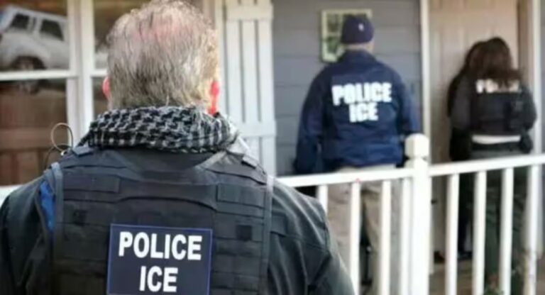 ICE agents conducting an operation at a residence.